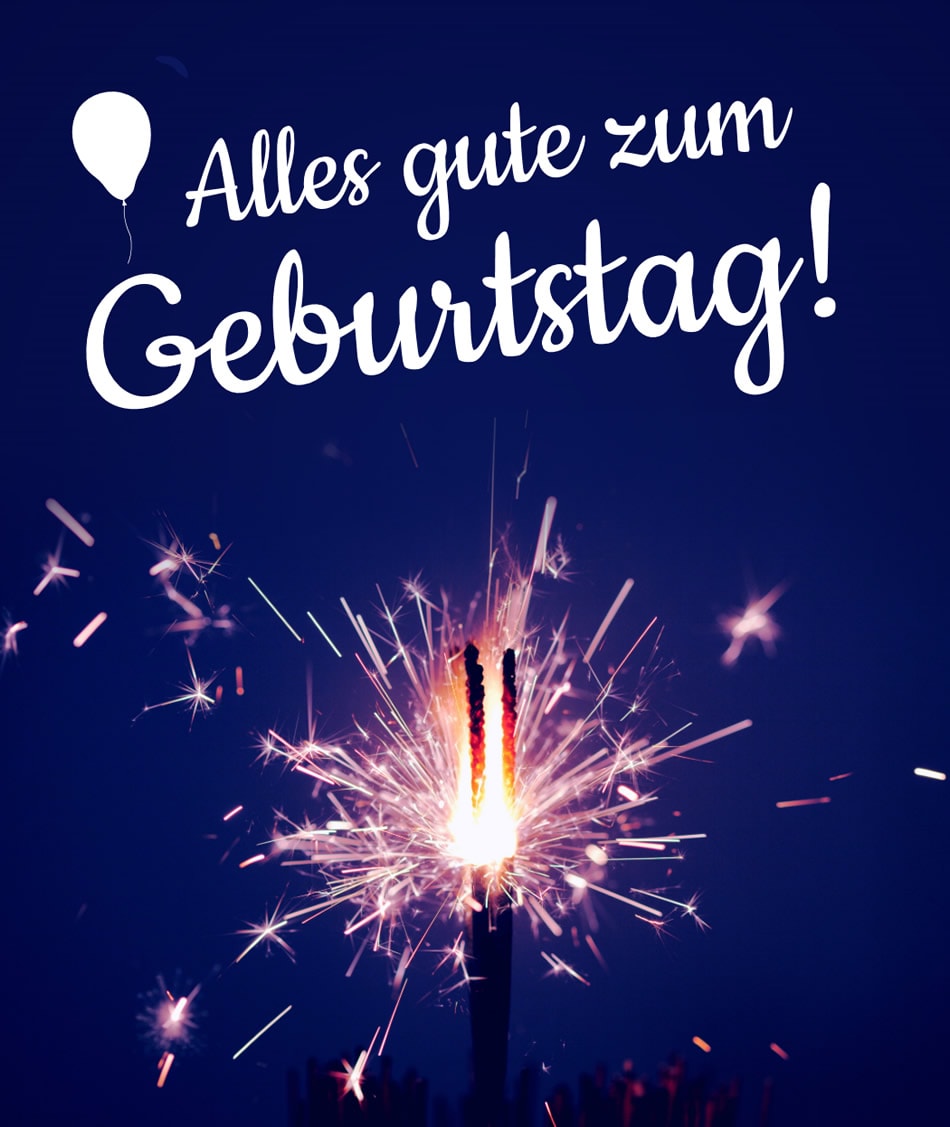 Brennende Wunderkerze bei Nacht mit Text „Alles gute zum Geburtstag!“ und Ballon-Silhouette