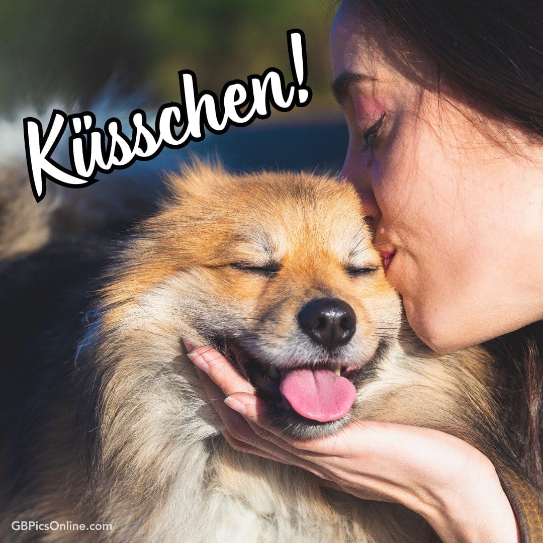 Eine Frau küsst einen glücklichen Hund mit Text „Küsschen!“
