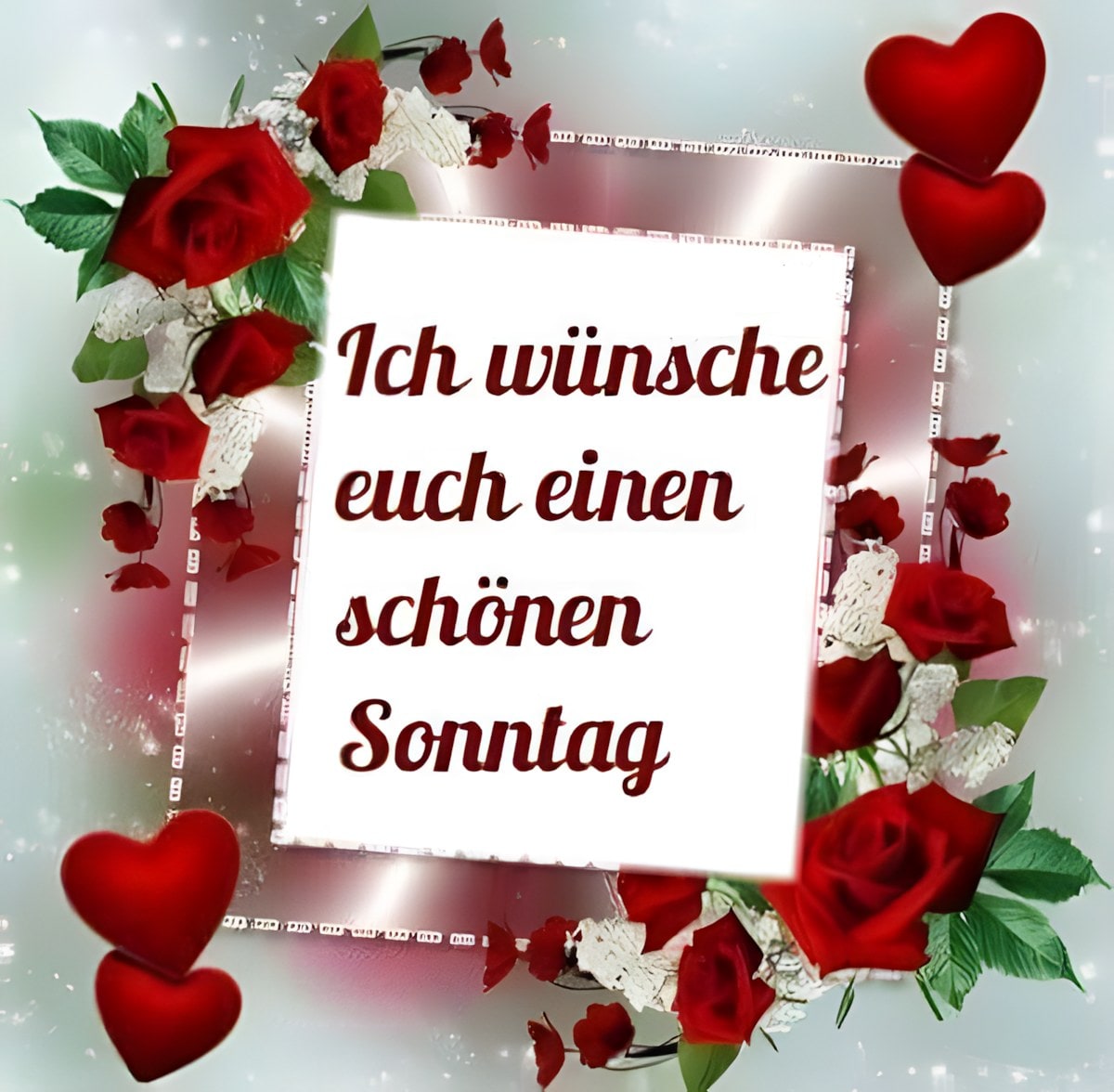 Notiz mit der Aufschrift „Ich wünsche euch einen schönen Sonntag“, umgeben von roten Rosen und Herzen