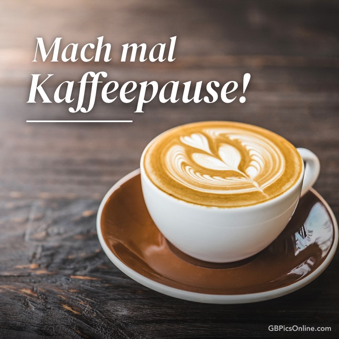 Ein Cappuccino mit Herz-Muster, Text: „Mach mal Kaffeepause!“