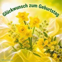 Gelbe Narzissen und Frühlingsblumen vor hellem Hintergrund mit Glückwunsch zum Geburtstag