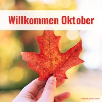 Herbstbeginn mit einem leuchtenden Blatt in der Hand.