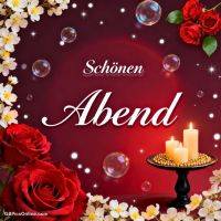 Rote Rosen, weiße Blüten und Kerzen auf rotem Hintergrund mit Seifenblasen und dem Gruß „Schönen Abend“