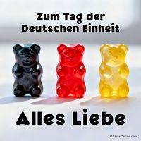 Drei Gummibärchen in Schwarz, Rot und Gold mit Gruß zum Tag der Deutschen Einheit